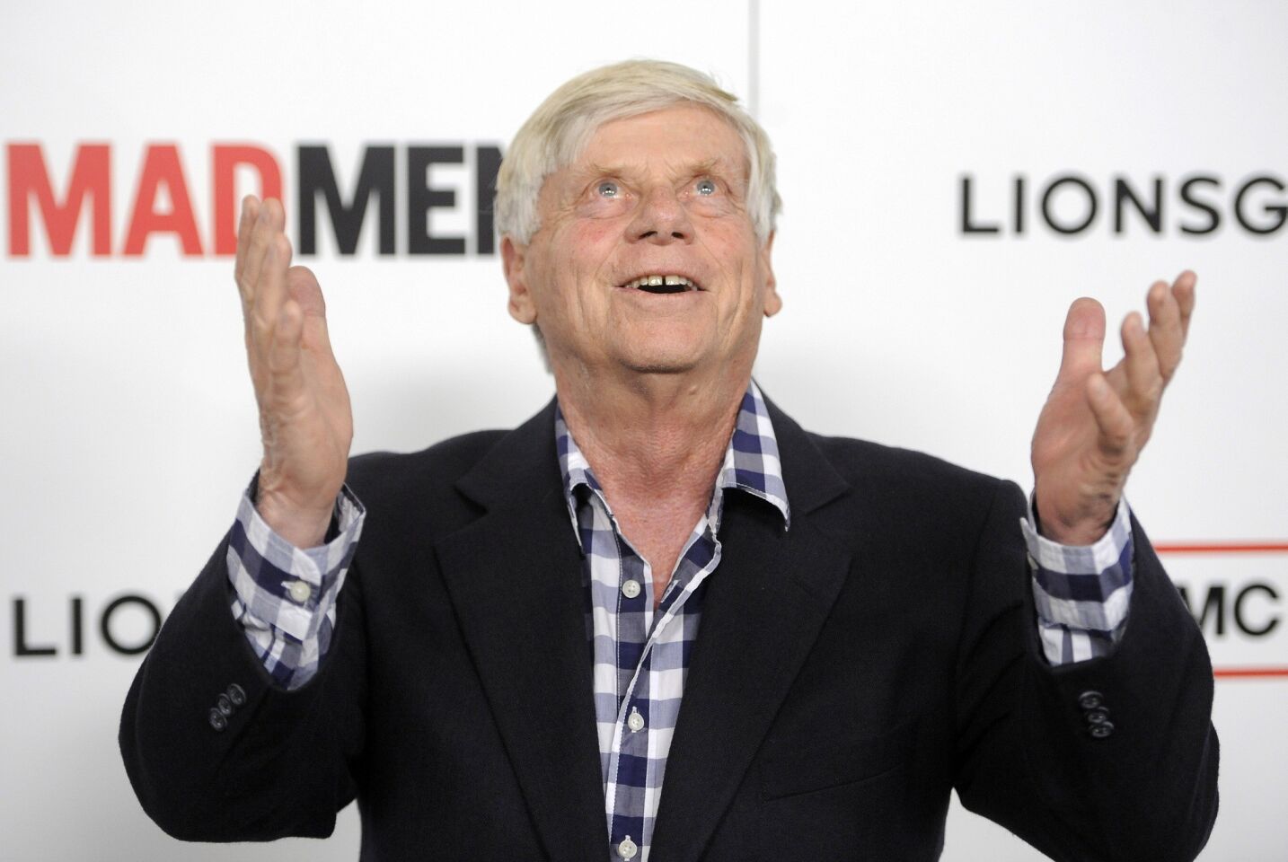 Robert Morse, photographed her with his shirt unbuttoned, plays the always bow-tied Bertram "Burt" Cooper, one of the founders of the ad company Sterling Cooper.