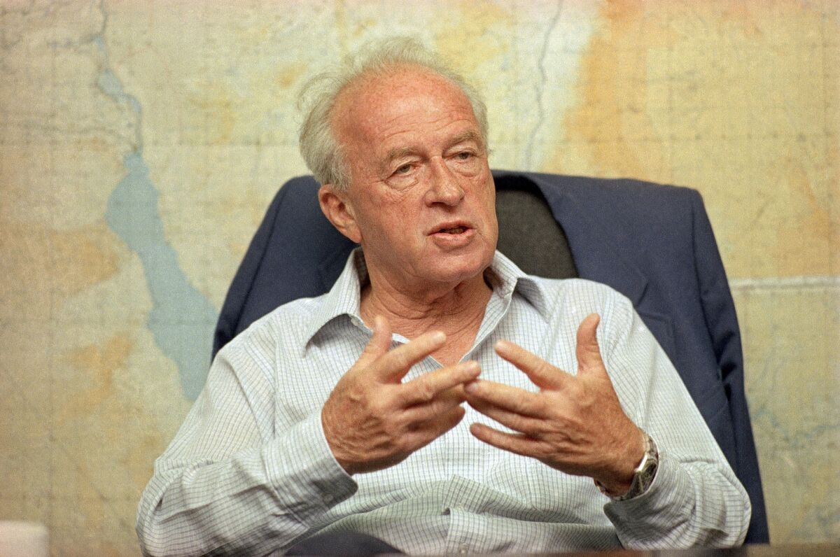 Then Israeli Defense Minister Yitzhak Rabin talks with the Associated Press on May 18, 1989 at the Ministry of Defense office, in Tel Aviv, Israel.