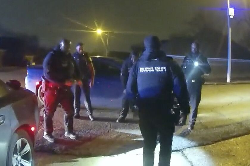 An image from video shows police officers talking after beating Tyre Nichols on Jan. 7, 2023, in Memphis, Tenn.  