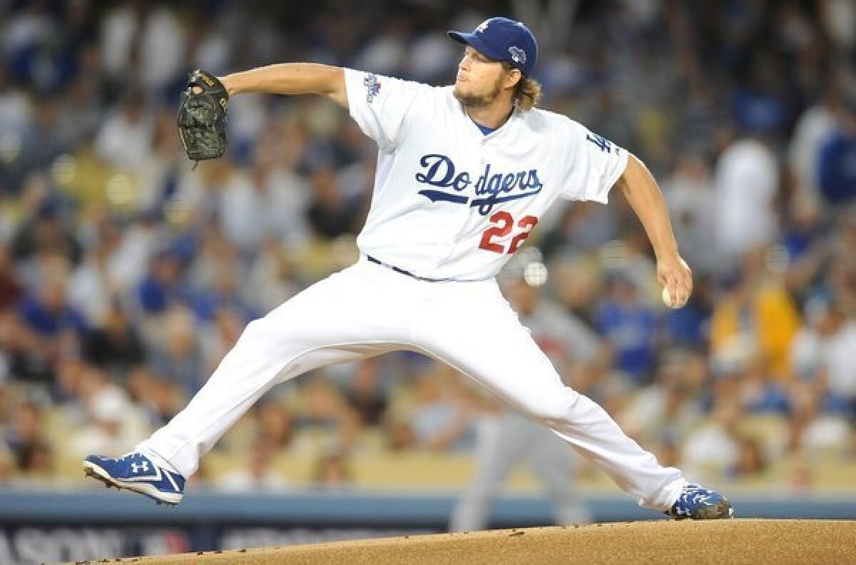 Dodgers starter Clayton Kershaw delivers a pitch during the first inning of the Dodgers' 4-3 victory over the Atlanta Braves in Game 4 of the National League division series Monday.