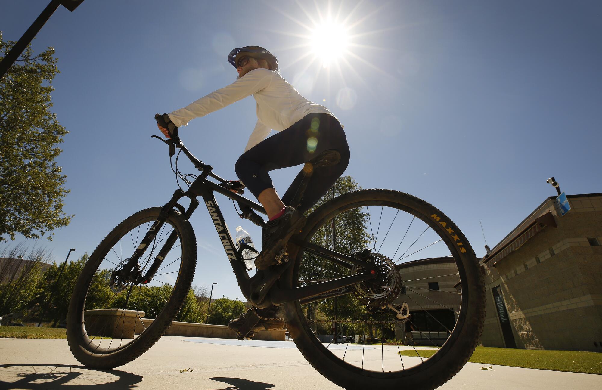 Patti Costello wasn't going to let a little heat stop her from her mountain bike ride at Juan Bautista de Anza Park.