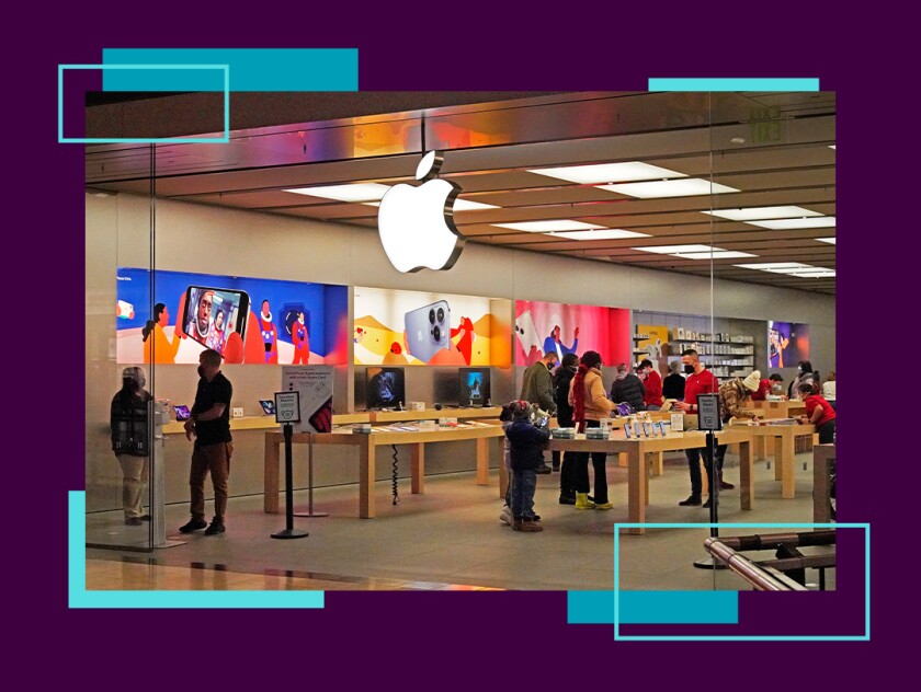 Shoppers browse inside an Apple retail store.