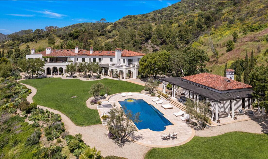 The Tuscan-style home holds 10 bedrooms and 22 bathrooms across three stories and 24,000 square feet.