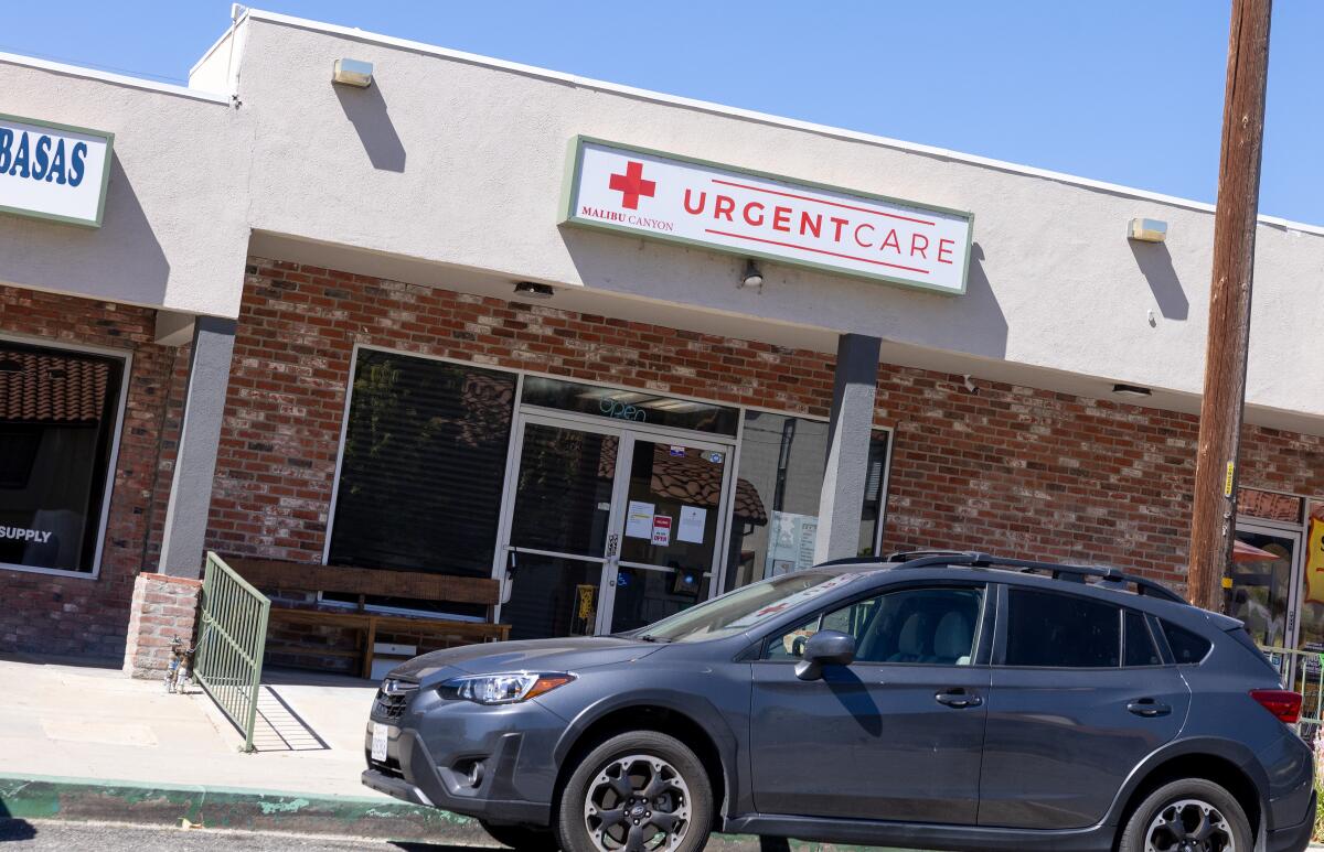 A car parked outside a clinic.