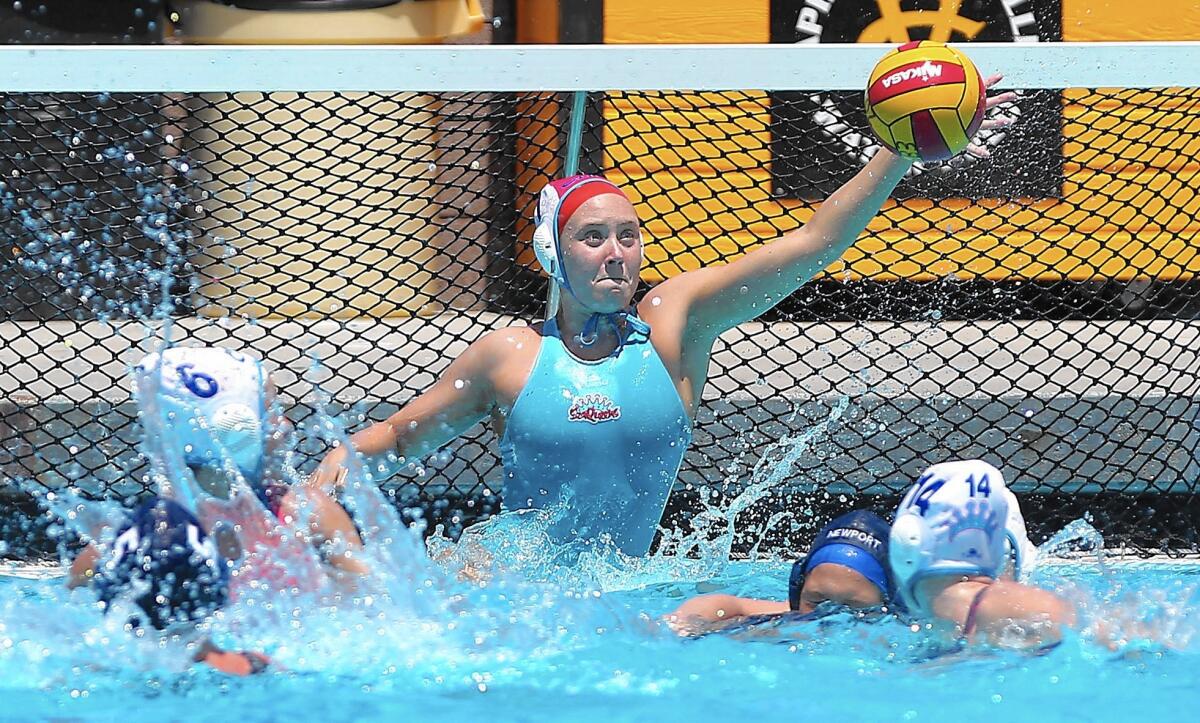 Goalie Heidi Ritner of CdM makes a stop at close range during a USA Water Polo Junior Olympics girls' 18U platinum division game against rival Newport Beach on Saturday.