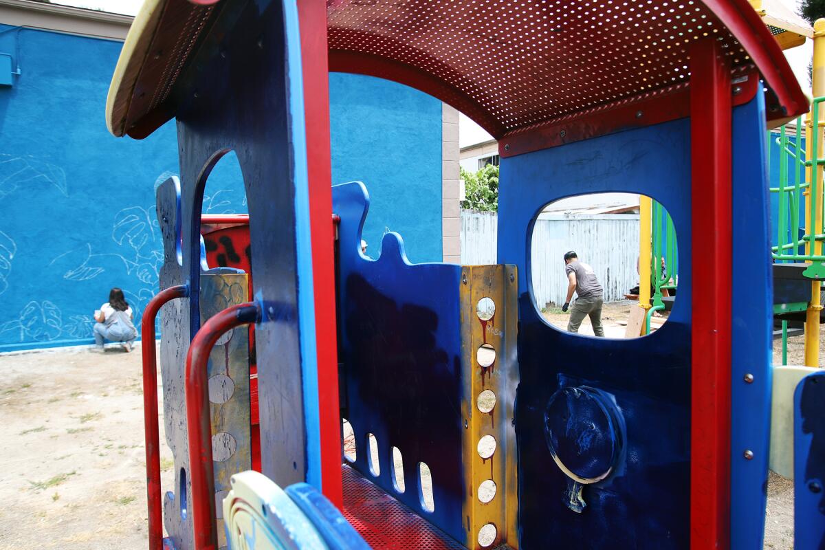 The playground at Bishop Manor in Santa Ana sits roughly in the middle of the long under-served community.