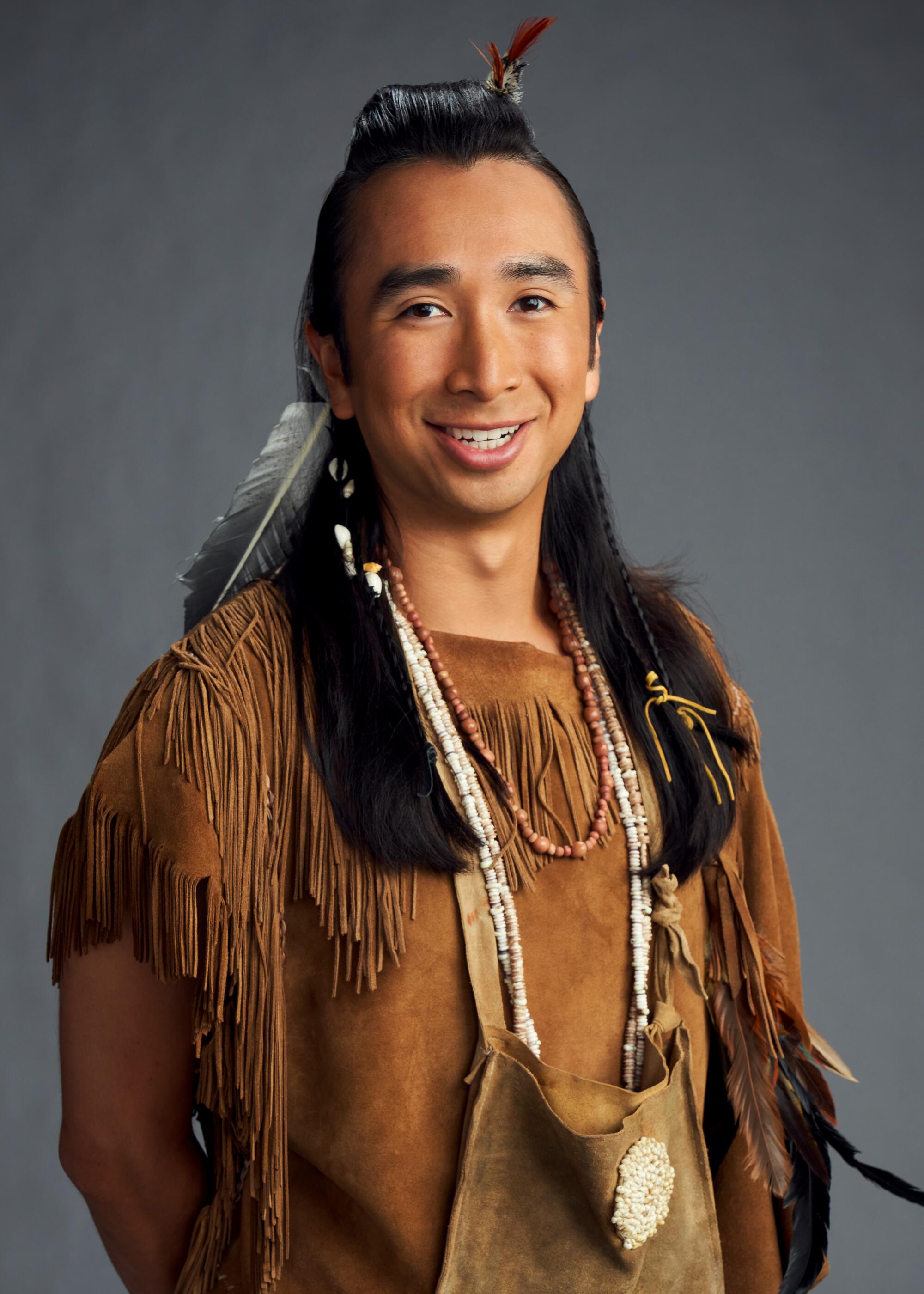 Roman Zaragoza as Sasappis, is dressed as a Native American.