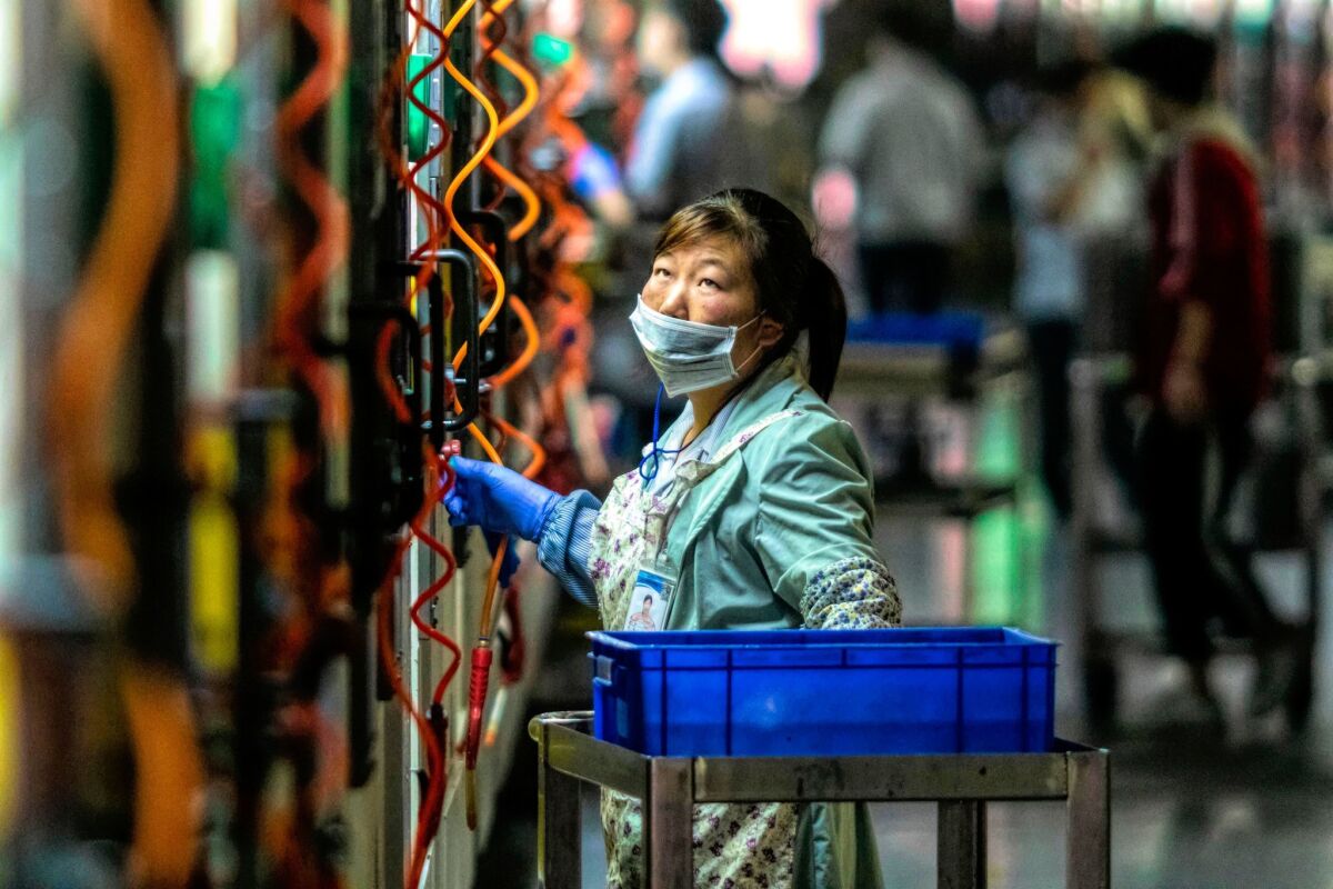 A worker at the Everwin precision technology factory in Dongguan, in China's Guangdong province.