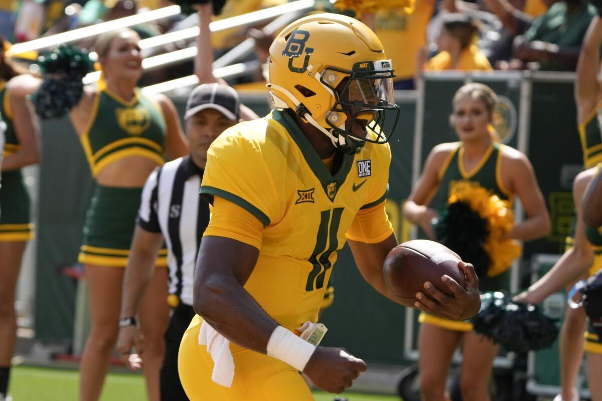 Baylor quarterback Gerry Bohanon (11) runs in for a touchdown against Iowa State on Sept. 25, 2021.