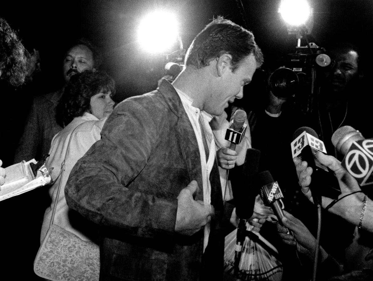 Harry Peak emerges into the glare of TV lights after being released from jail on Mar. 2, 1987.