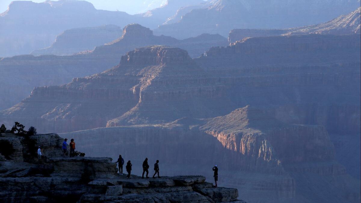 Visitors take photos of the Grand Canyon in Grand Canyon, Ariz. on March 9, 2015.