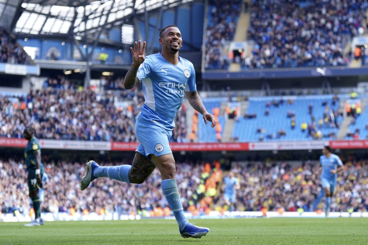 Manchester City's Gabriel Jesus celebrates after scoring his fourth goal, his side's fifth, during the English Premier League soccer match between Manchester City and Watford at Etihad stadium in Manchester, England, Saturday, April 23, 2022. (AP Photo/Jon Super)
