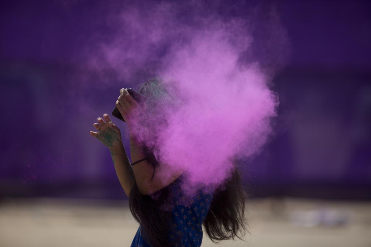 Colored powder covers the face of a Holi reveler in Hyderabad, India. (Mahesh Kumar A. / Associated Press)