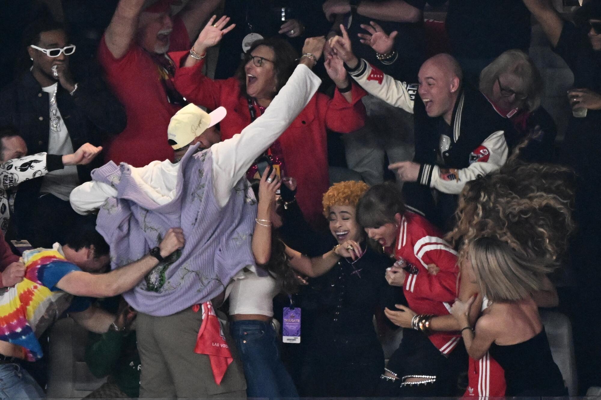 Taylor Swift, bottom right, and others celebrate after the Chiefs win Super Bowl LVIII.