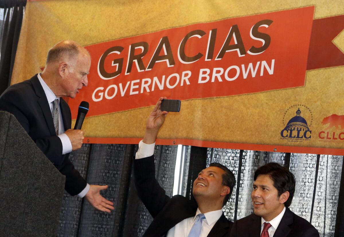 Sen. Alex Padilla, center, at a June event with Gov. Jerry Brown, left, and Sen. Kevin de Leon. On Thursday, Brown signed a measure by Padilla requiring civilian investigation and prosecution of military sexual assault allegations.