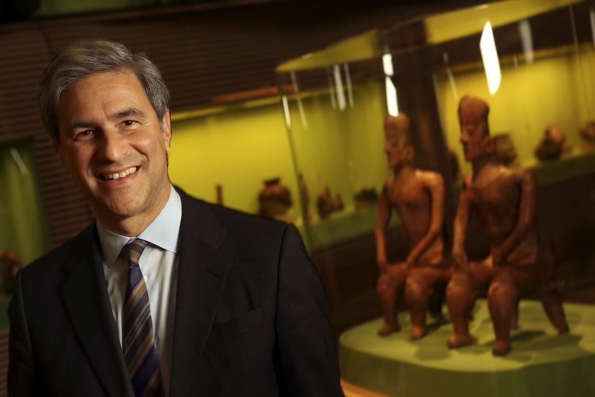 LACMA Director Michael Govan is shown next to pieces from the pre-Columbian collection inside the museum's West Mexico room.
