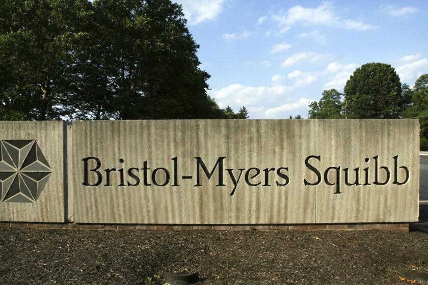 FILE - In this June 15, 2005, file photo, a sign stands in front of a Bristol-Myers Squibb building in a Lawrence Township, N.J. Bristol-Myers Squibb is buying Celgene in a cash-and-stock deal valued at about $74 billion. (AP Photo/Mel Evans, File)