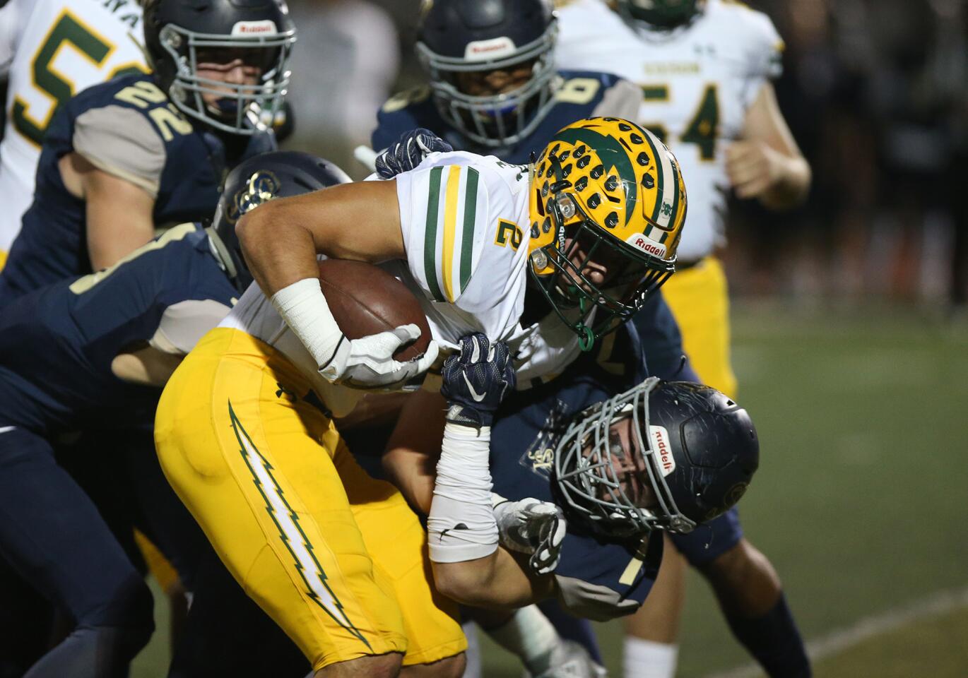 Mike Walters gains a first down for Edison High in the first round of the CIF Southern Section Division 2 playoffs at San Juan Hills High on Friday.