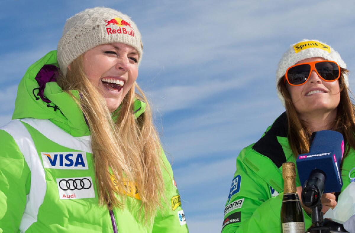 Lindsey Vonn and Julie Mancuso share a laugh during a news conference in Austria before the World Cup season opener.