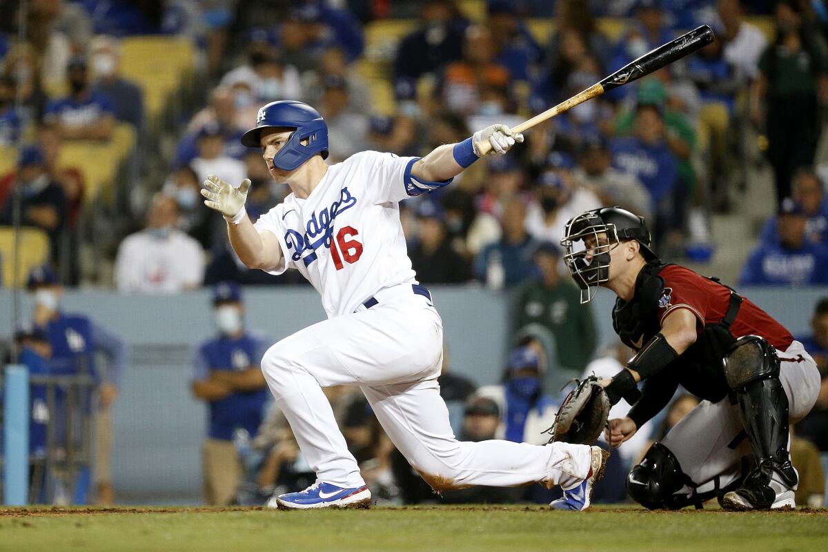 Catcher Will Smith follows through on a swing during an at-bat