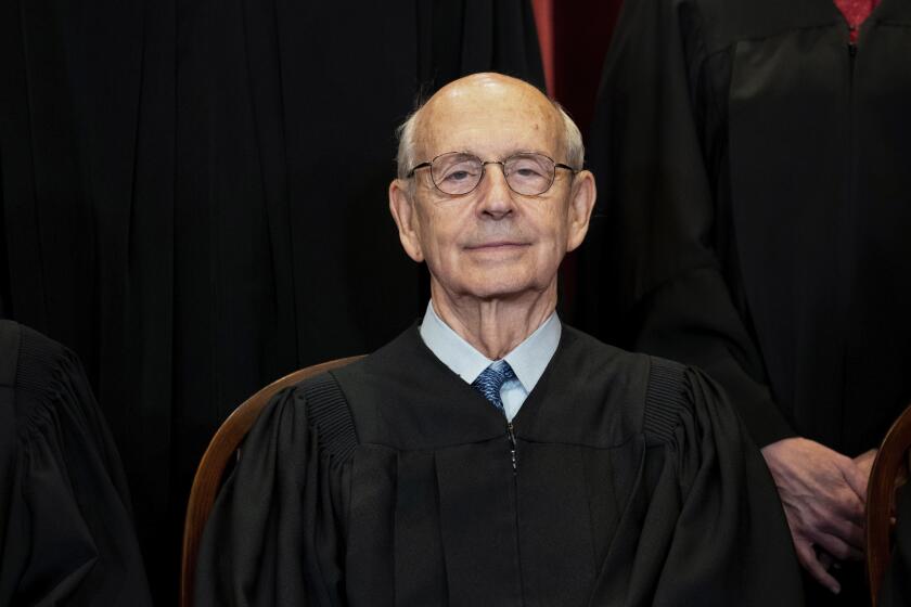 FILE - In this April 23, 2021, file photo, Supreme Court Associate Justice Stephen Breyer sits during a group photo at the Supreme Court in Washington. The Supreme Court is wrapping up its first all-virtual term, with decisions expected in a key case on voting rights and another involving information California requires charities to provide about donors. The court's last day of work Thursday, July 1, before its summer break also could include a retirement announcement, although the oldest of the justices, Breyer, has given no indication he intends to step down this year. (Erin Schaff/The New York Times via AP, Pool)