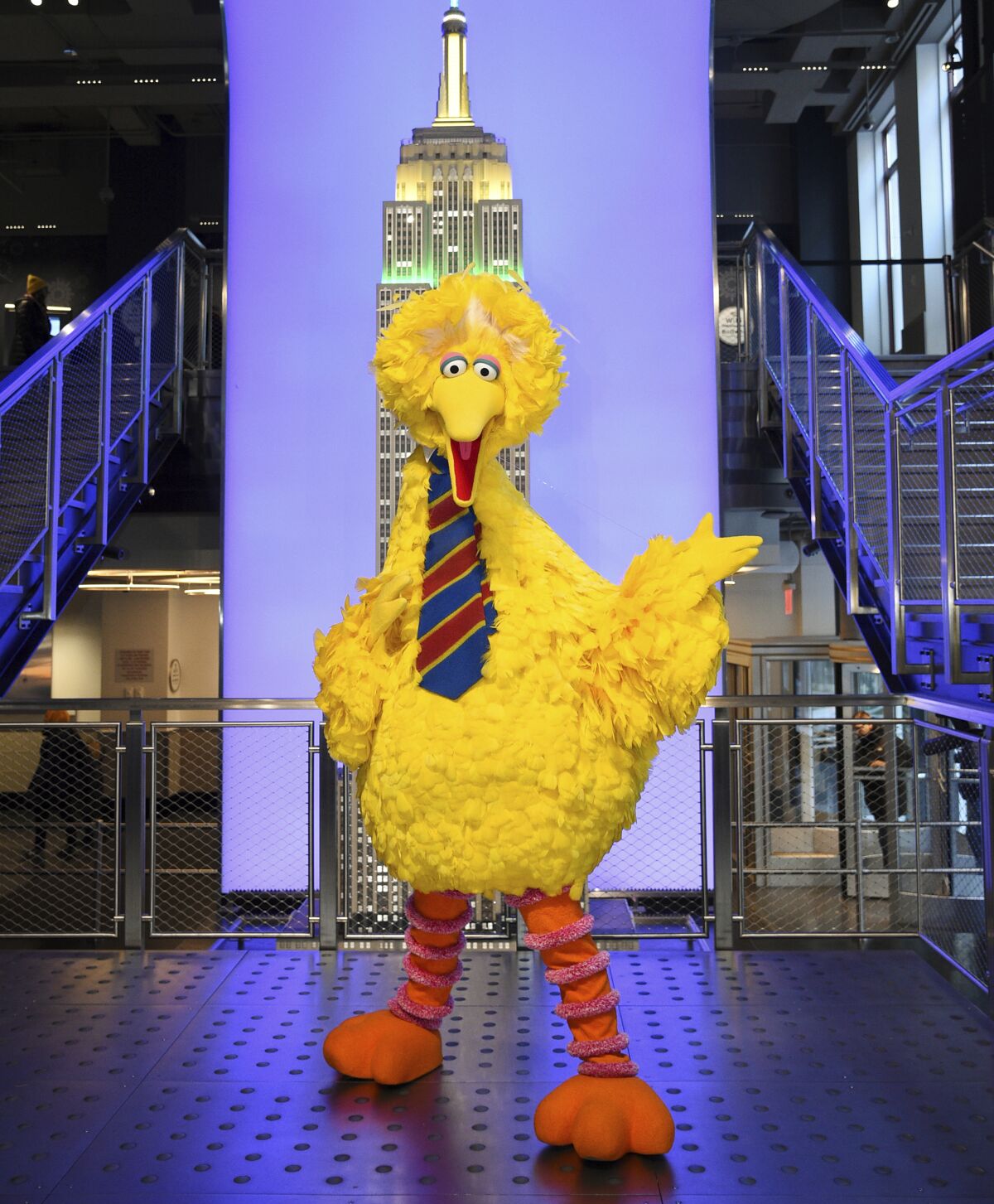 FILE - Sesame Street's Big Bird participates in the ceremonial lighting of the Empire State Building in honor of Sesame Street's 50th anniversary on Friday, Nov. 8, 2019, in New York. When Big Bird tweeted he had been vaccinated against COVID-19, conservative politicians immediately pushed back, including Ted Cruz who grilled Big Bird for what he called “government propaganda.” (Photo by Evan Agostini/Invision/AP, File)
