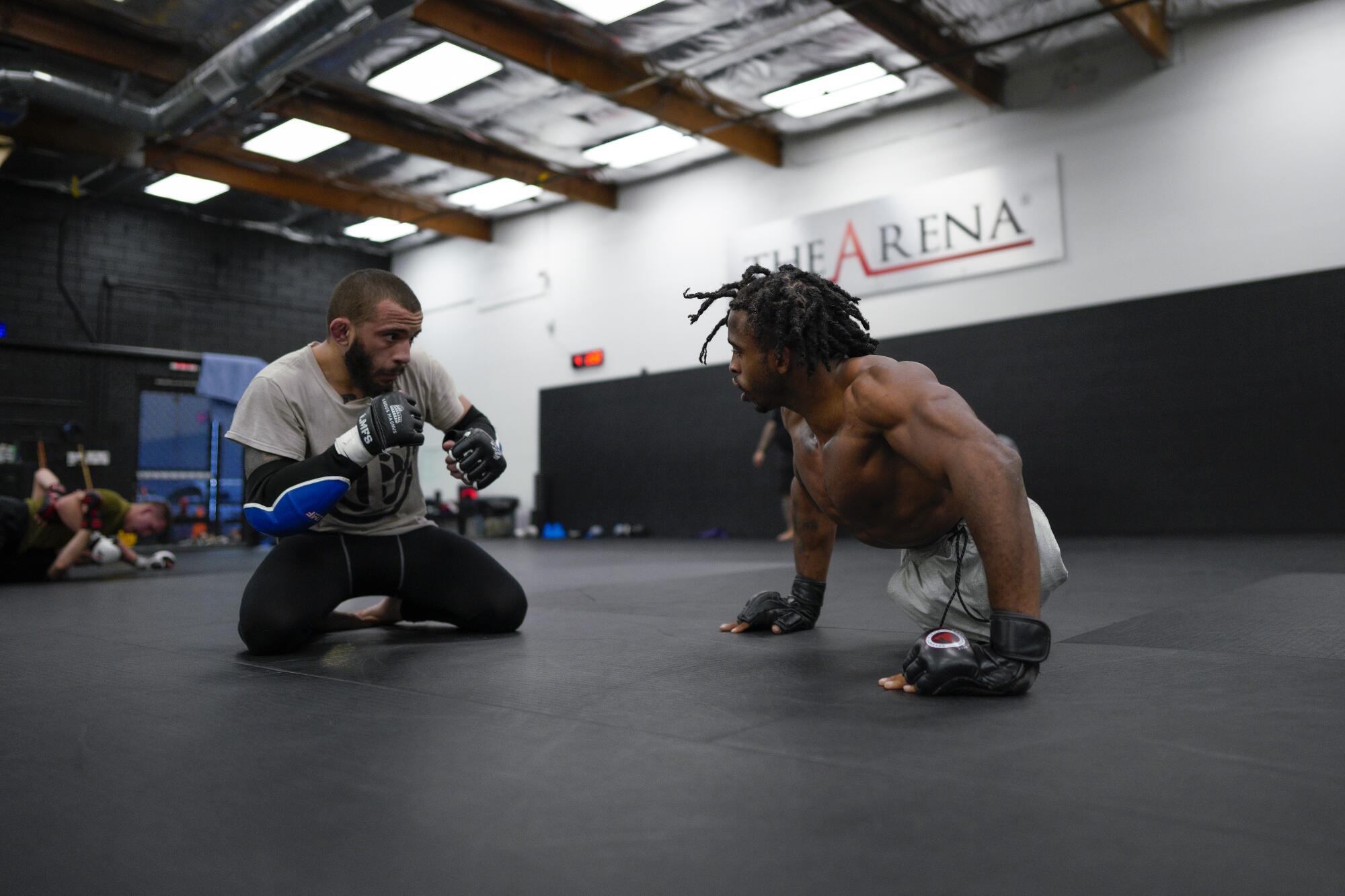 Zion Clark, right, runs through a workout with a sparring partner at The Arena gym in San Diego.  