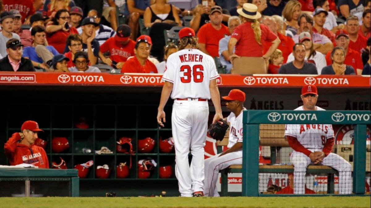 Angels pitcher Jered Weaver heads to the bench after giving up four home runs to the Yankees during a game on Aug. 19.