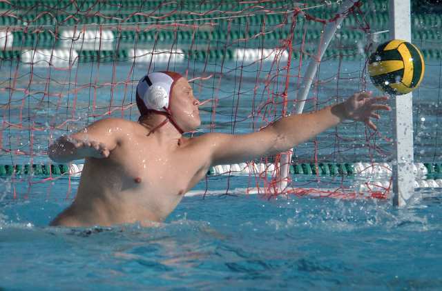 Estancia's Goalkeeper Garrett Henshied reaches to block a shot from Costa Mesa during the Battle for the Bell.