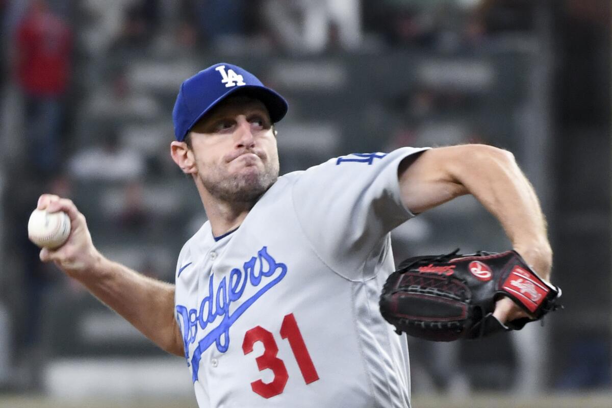 Dodgers starting pitcher Max Scherzer delivers during Game 2 of the NLCS against the Atlanta Braves on Oct. 17.