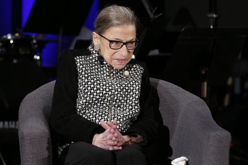 FILE - In this Dec. 17, 2019, file photo Supreme Court Justice Ruth Bader Ginsburg speaks with author Jeffrey Rosen at the National Constitution Center Americas Town Hall at the National Museum of Women in the Arts in Washington. (AP Photo/Steve Helber, File)