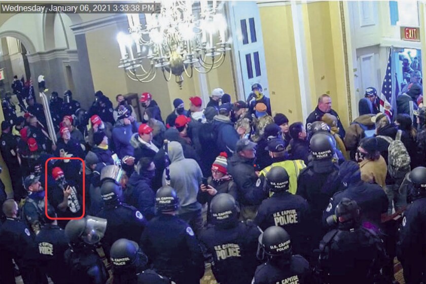 This image from U.S. Capitol Police security video, contained in the complaint against Billy Knutson, shows Knutson, annotated by the source, inside the U.S. Capitol on Jan. 6, 2021. Knutson was charged on Jan. 12, 2021, with storming the U.S. Capitol. He performed rap songs about the riot in videos posted on his YouTube channel, federal authorities say. (Department of Justice via AP)