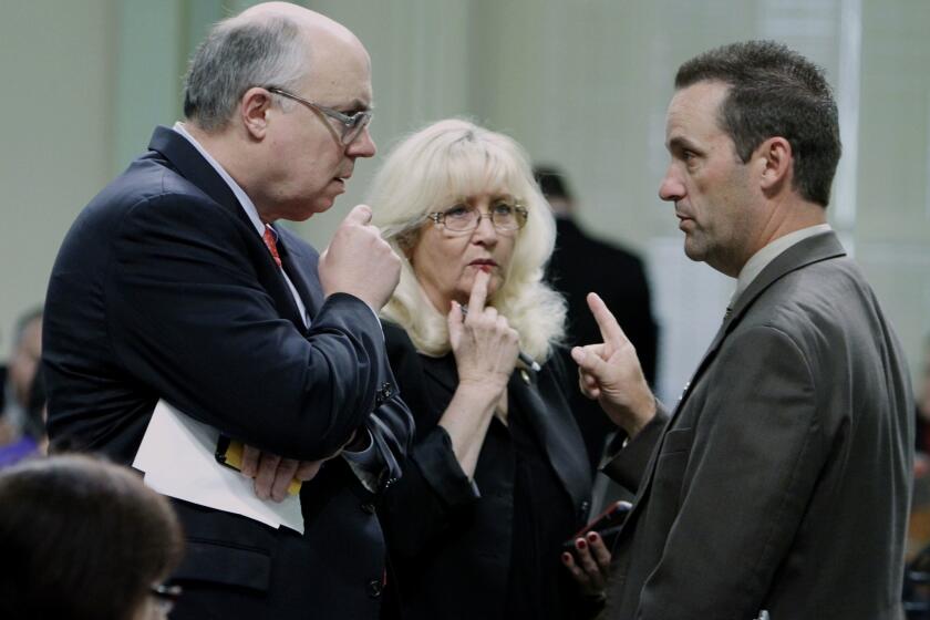 State Sen. Steve Knight, at right, confers with other legislators in 2011. He wants to run for Congress next year if Rep. Howard P. "Buck" McKeon, representing the 25th Congressional District, decides not to run.