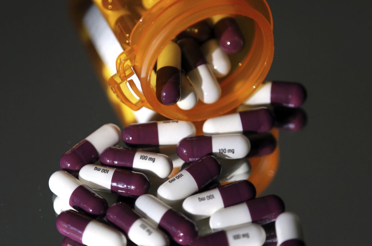 Pharmaceuticals spill from a pill bottle