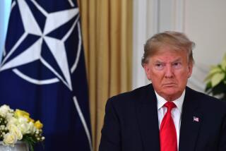 President Trump speaks during his meeting with NATO Secretary General Jens Stoltenberg in London on Tuesday.