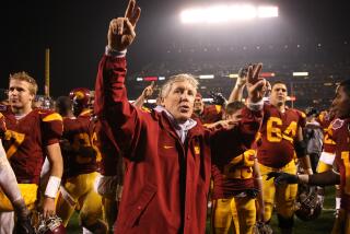 USC coach Pete Carroll celebrates after defeating the Boston College Eagles during the 2009 Emerald Bowl 