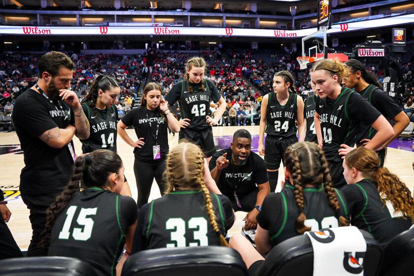 Coach Kerwin Walters of Sage Hill tries to rally his team in the Division I state final.