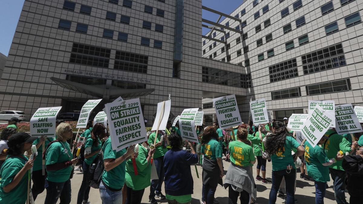 Demonstrators parade in front of Ronald Reagan UCLA Medical Center to support the American Federation of State, County and Municipal Employees Local 3299.