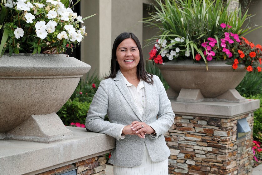 New City Manager Maggie Le stands outside Fountain Valley City Hall on Wednesday.