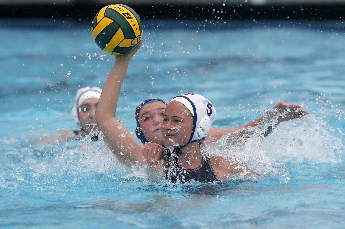 Flintridge Prep's Isabel Simons looks to shoot against Marina during the first half in the CIF Southern Section Division VI championship match at Woollett Aquatics Center in Irvine on Saturday.