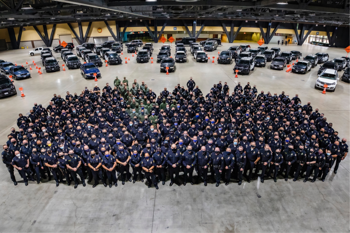 In the photo released by the Long Beach Police Department, officers are masked