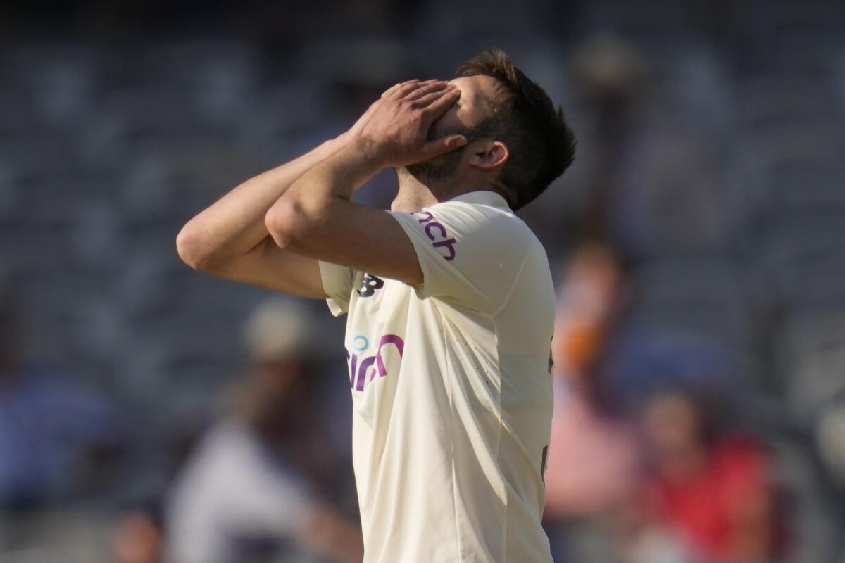 England's Mark Wood reacts after bowling during the fourth day of the Test match between England and New Zealand at Lord's cricket ground in London, Saturday, June 5, 2021. (AP Photo/Kirsty Wigglesworth)
