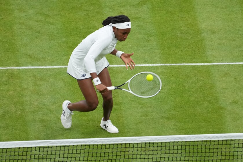 Coco Gauff of the U.S. plays against Russia's Veronika Kudermetova and Elena Vesnina during the women's doubles third round match on day eight of the Wimbledon Tennis Championships in London, Tuesday, July 6, 2021. (AP Photo/Alberto Pezzali)