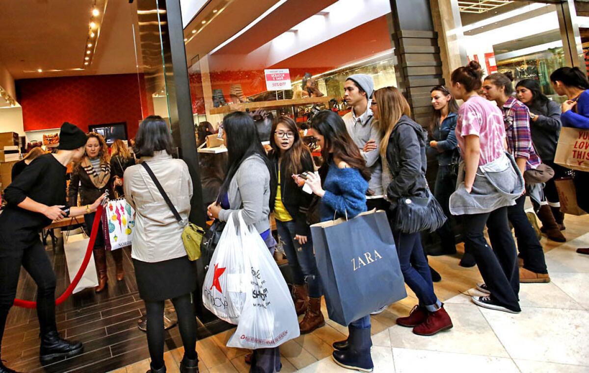 Black Friday shoppers in Costa Mesa. November retail sales missed expectations.