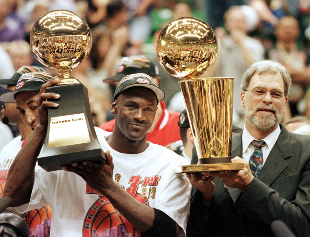 Michael Jordan and Chicago Bulls head coach Phil Jackson