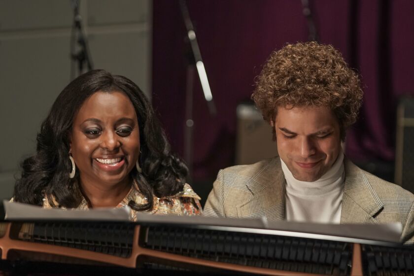 Gladys Knight (played by Ledisi) & Casablanca Records founder Neil Bogart (Jeremy Jordan) sing at a piano in "Spinning Gold."