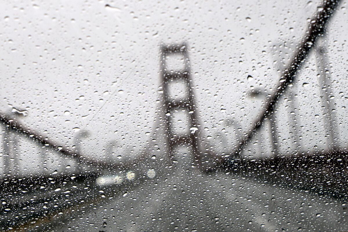 The Golden Gate Bridge seen through a rainy windshield