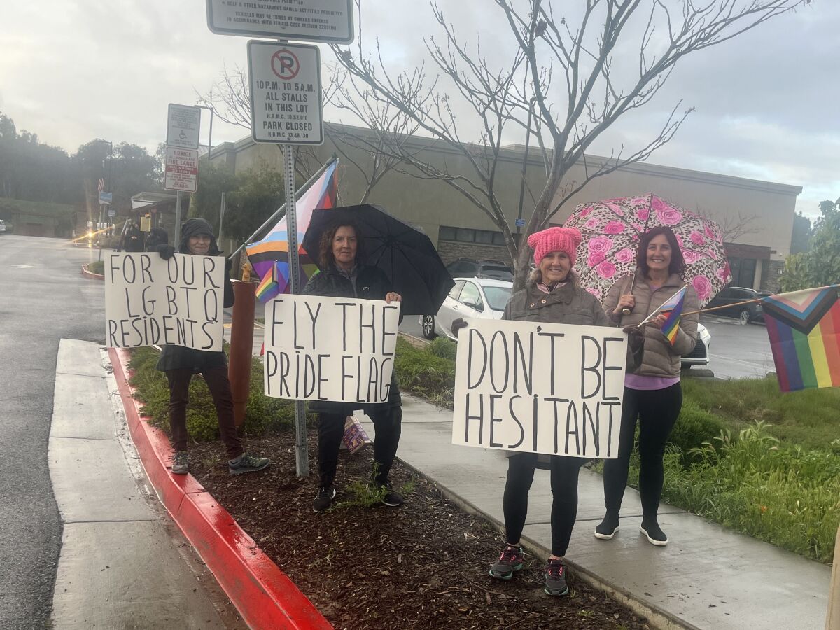Huntington Beach residents demonstrate outside of the Senior Center prior to the Mayor's Breakfast on Thursday.