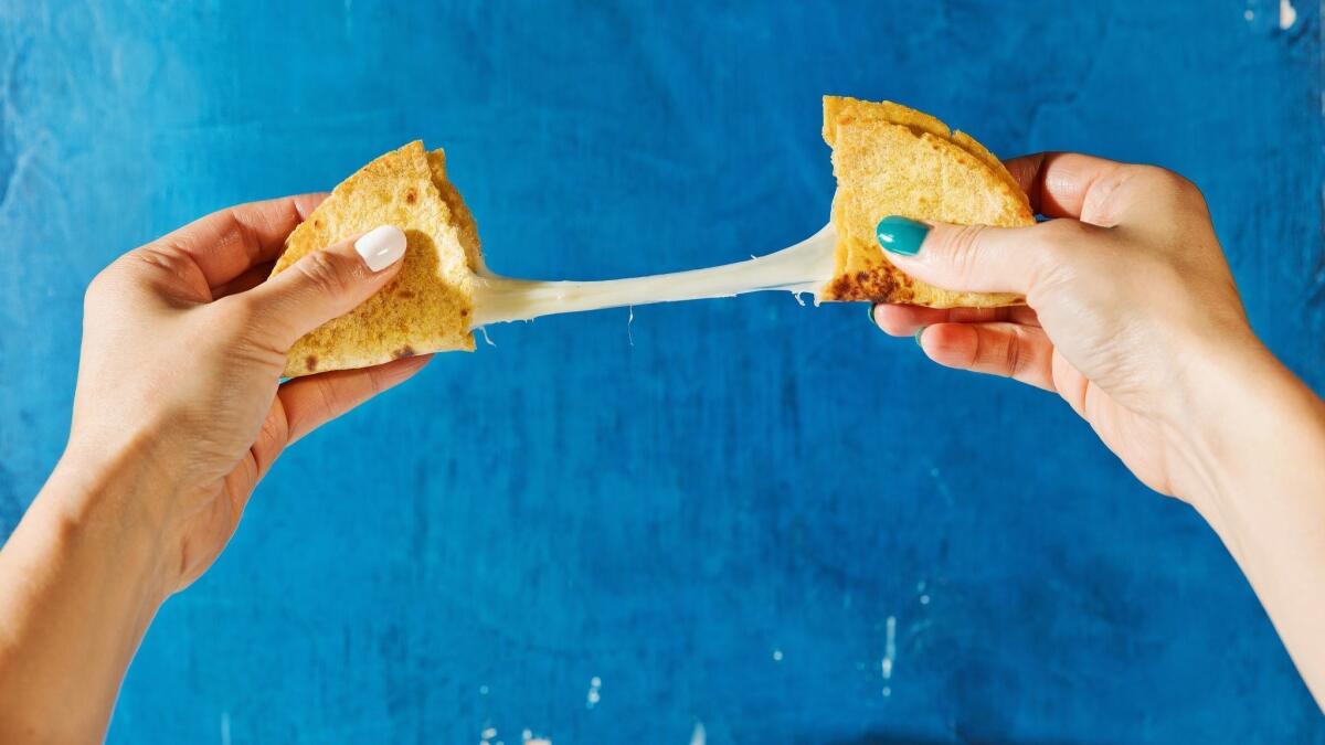 The seared cheese melts and becomes stretchy, making for the ultimate cheese pull.