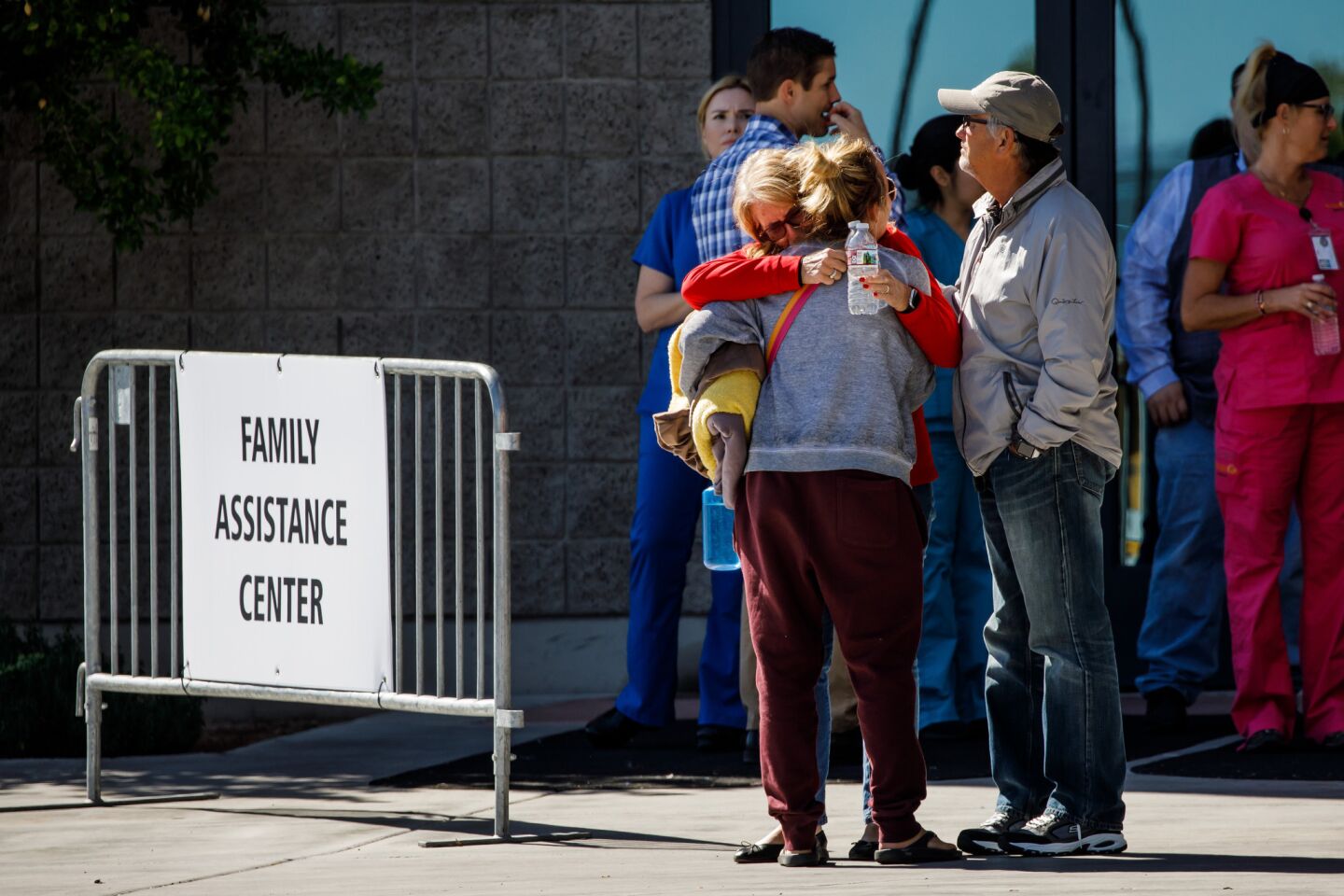 Relatives of victims from the mass shooting embrace outside a family assistance center in Las Vegas.